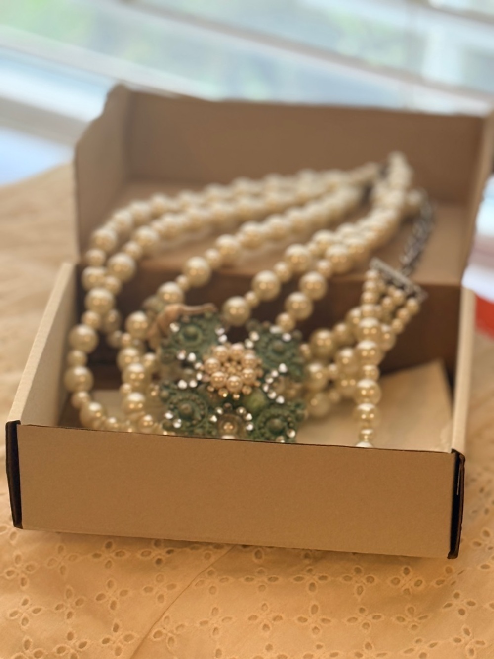A Rare Bird Multi-Strand Pearl Necklace with Green Crystal Floral Accent